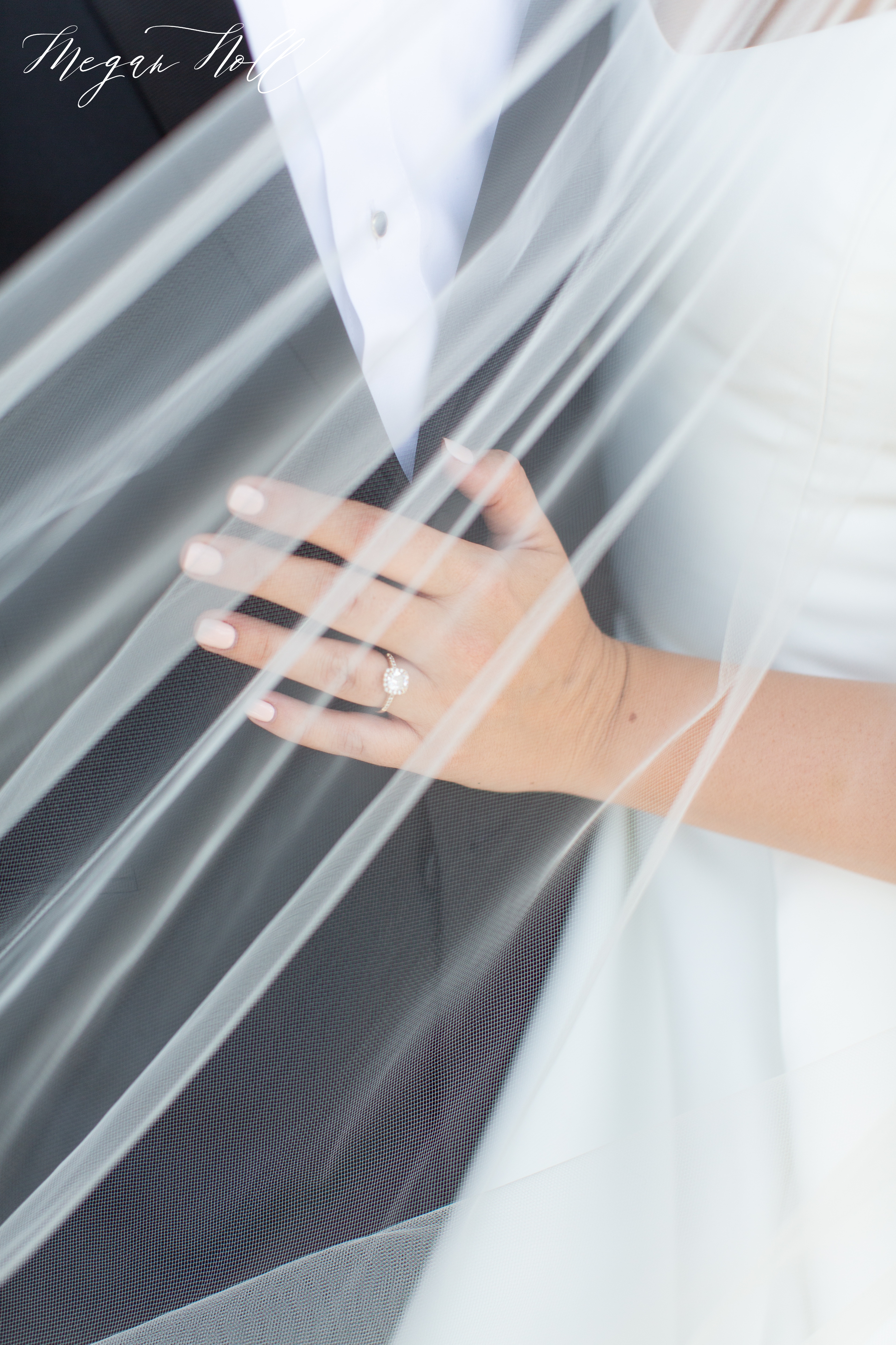 Brides hand on grooms chest