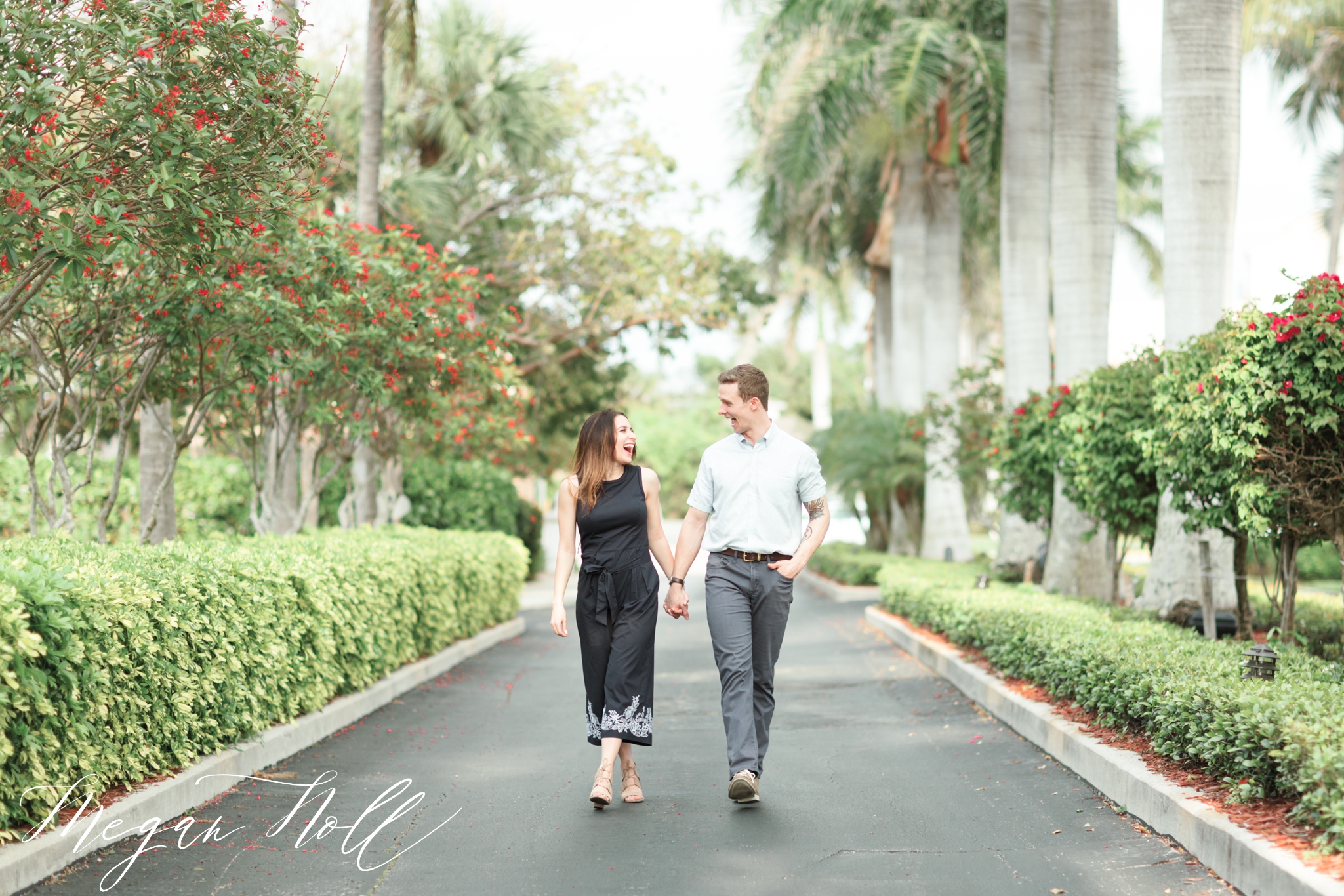 Woman walking with man, holding hands for engagement pictures in Florida