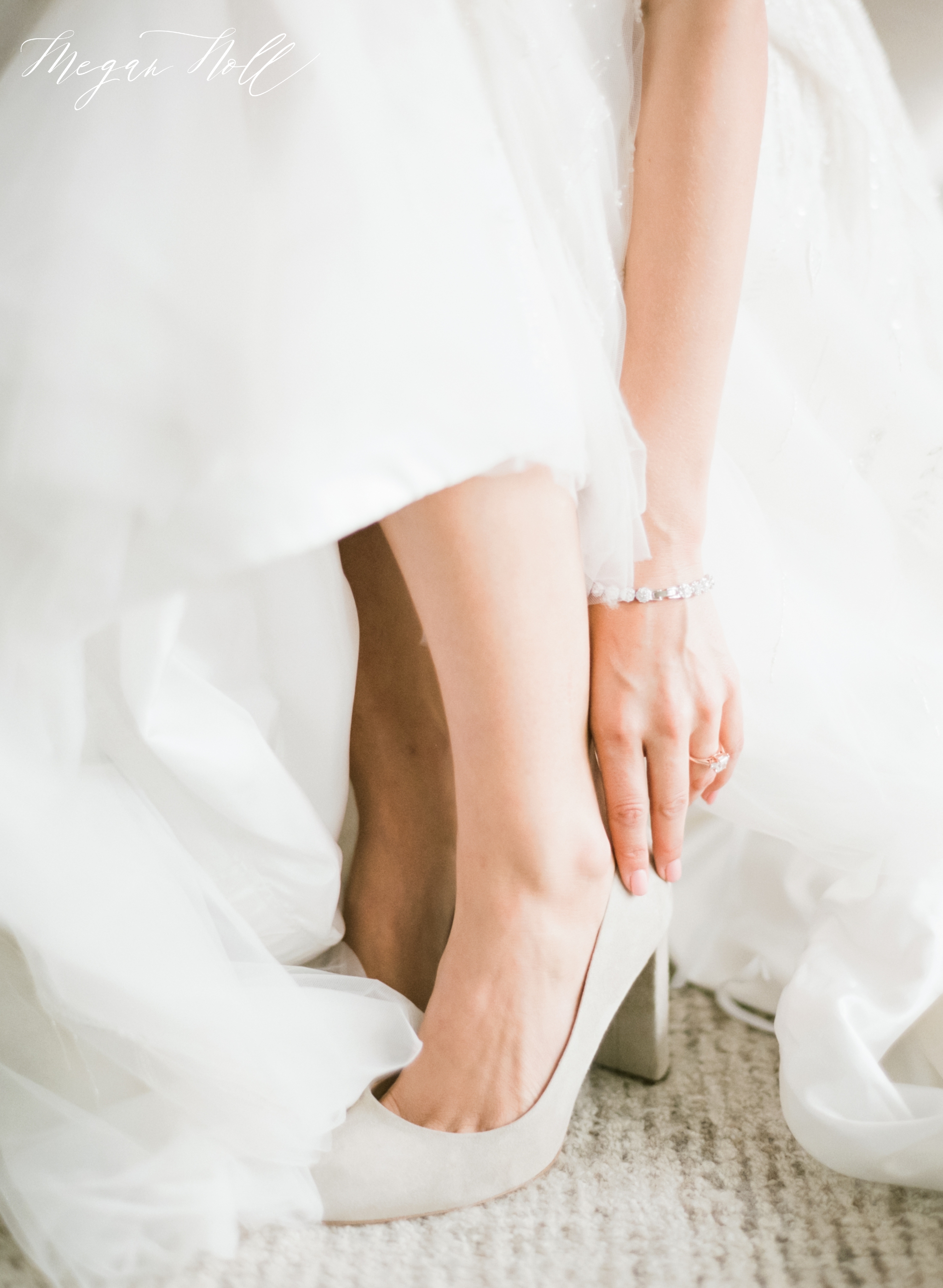 Close up of brides hand putting on shoe on Cincinnati Wedding Day