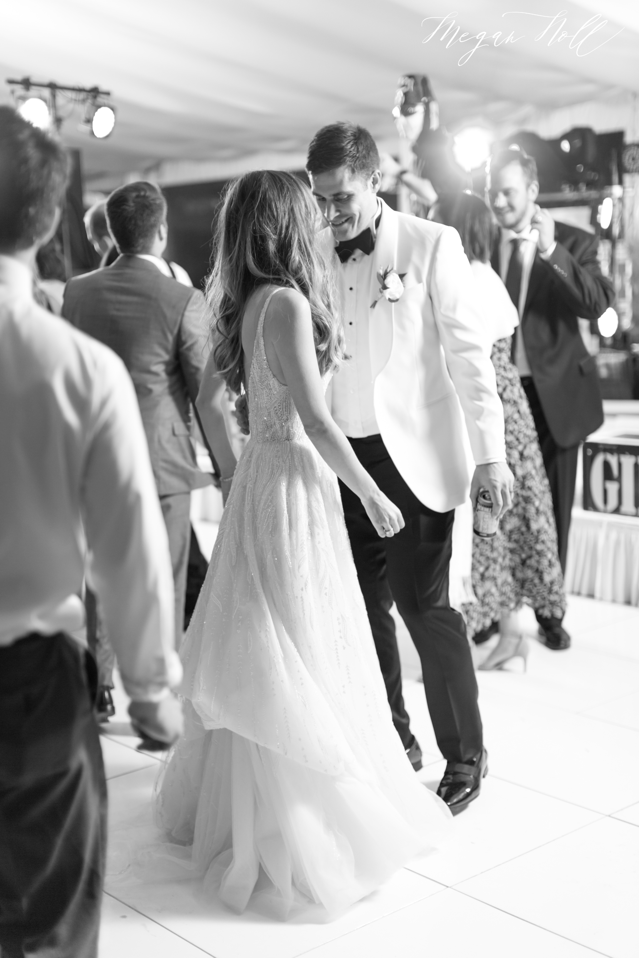 Bride and groom dancing after groom switches to a white dinner jacket