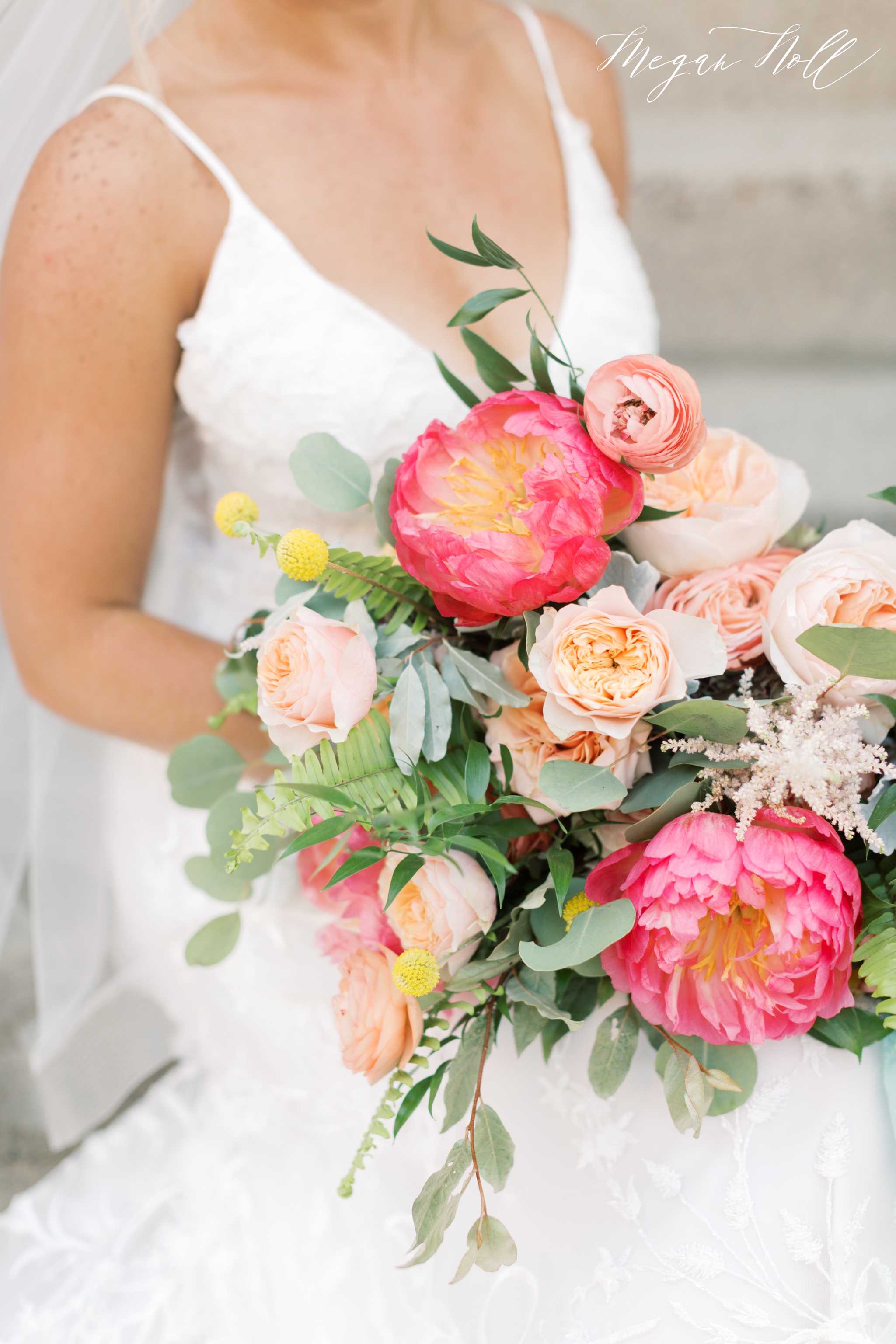 Bride holding wedding flowers from floral verde