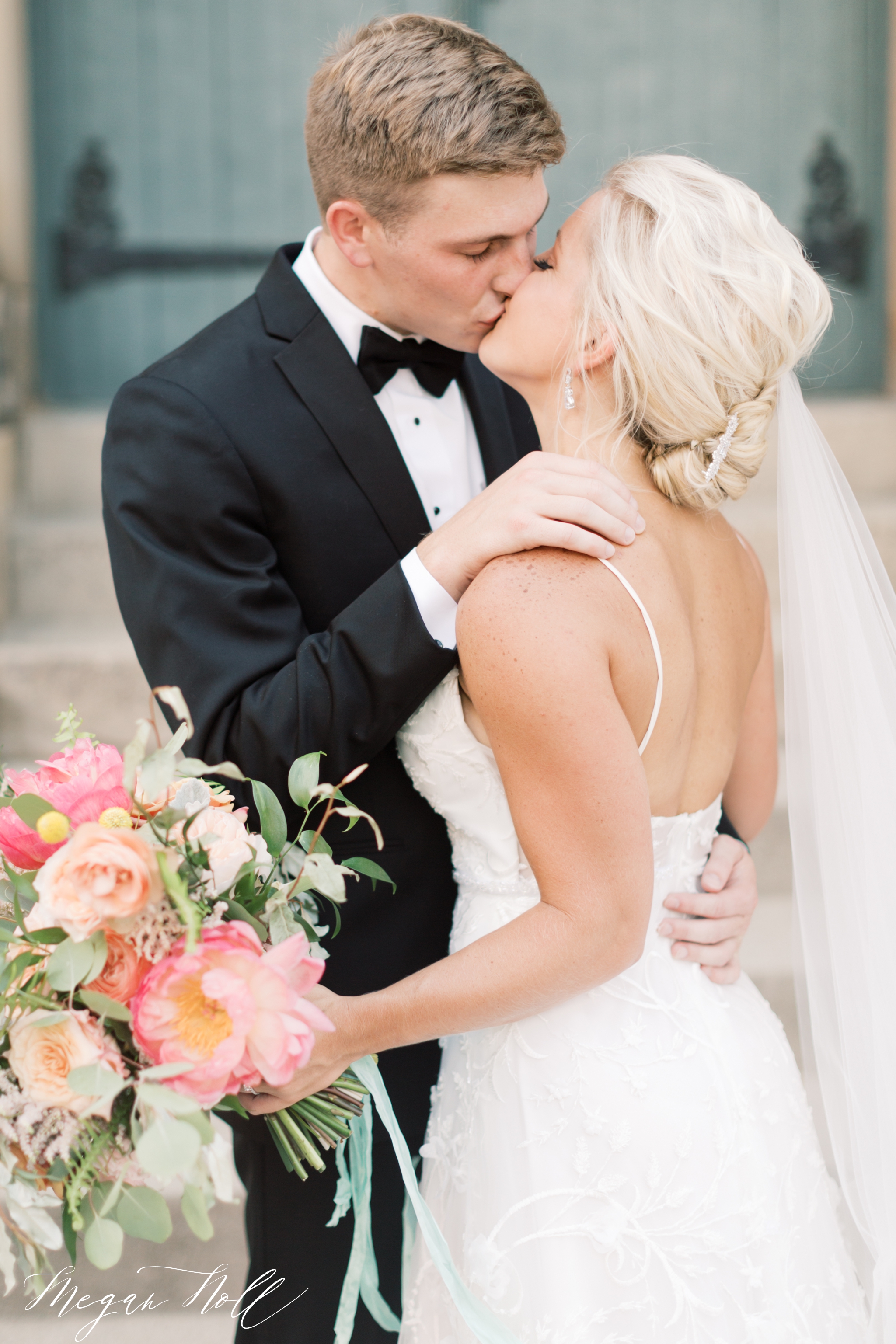 Bride and groom kissing in downtown Cincinnati