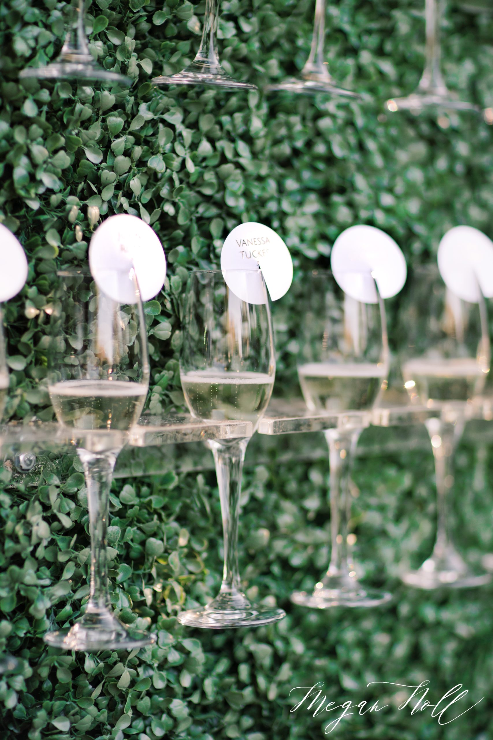 Champagne Wall holds guest cards designed by Some Like It Classic Wedding Planner