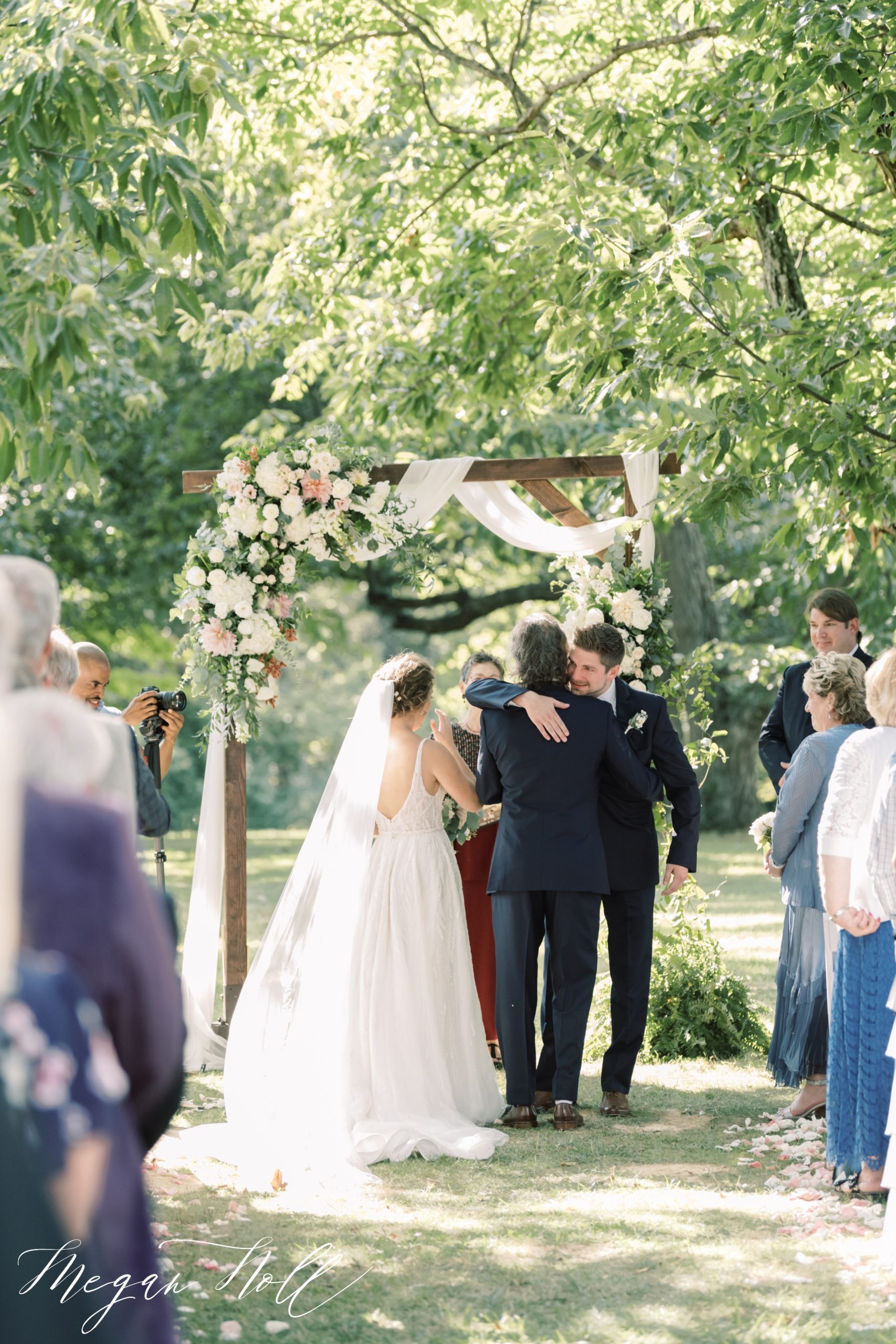 Father giving bride away in outdoor ceremony in cincinnati 