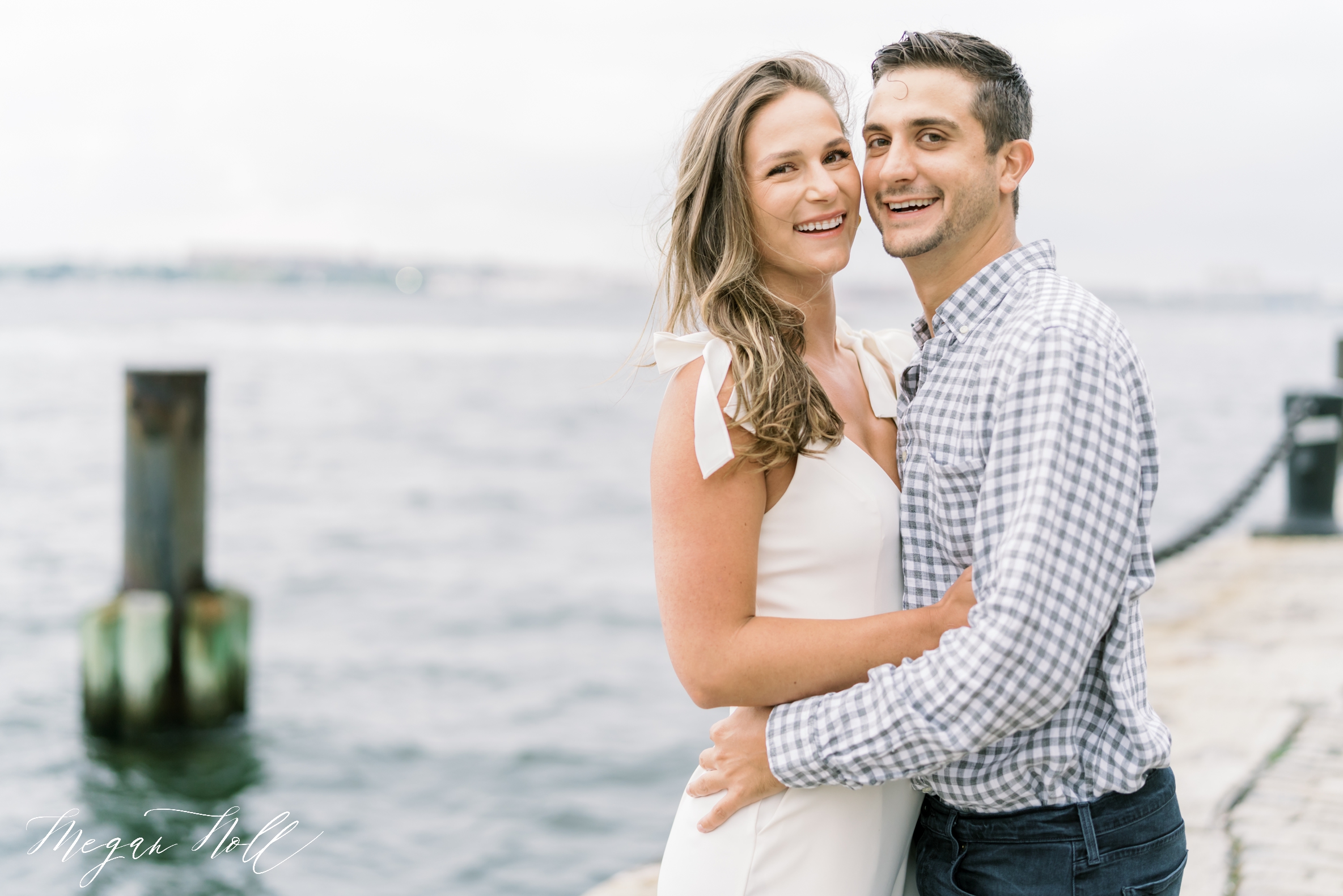Couple Laughing with Ocean in Background shot by Cincinnati Wedding Photographer