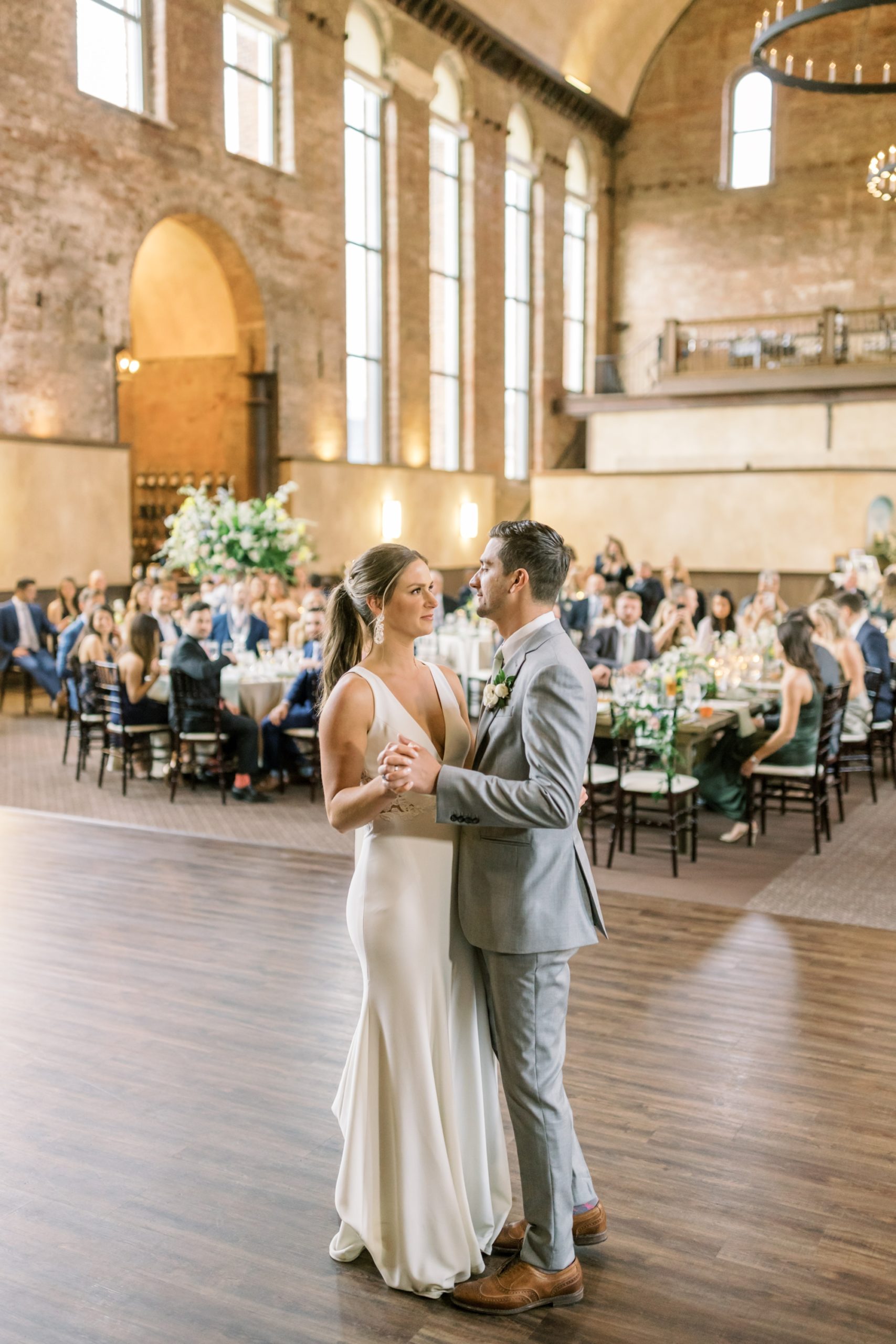 Photo of a bride and groom's first dance at their wedding reception