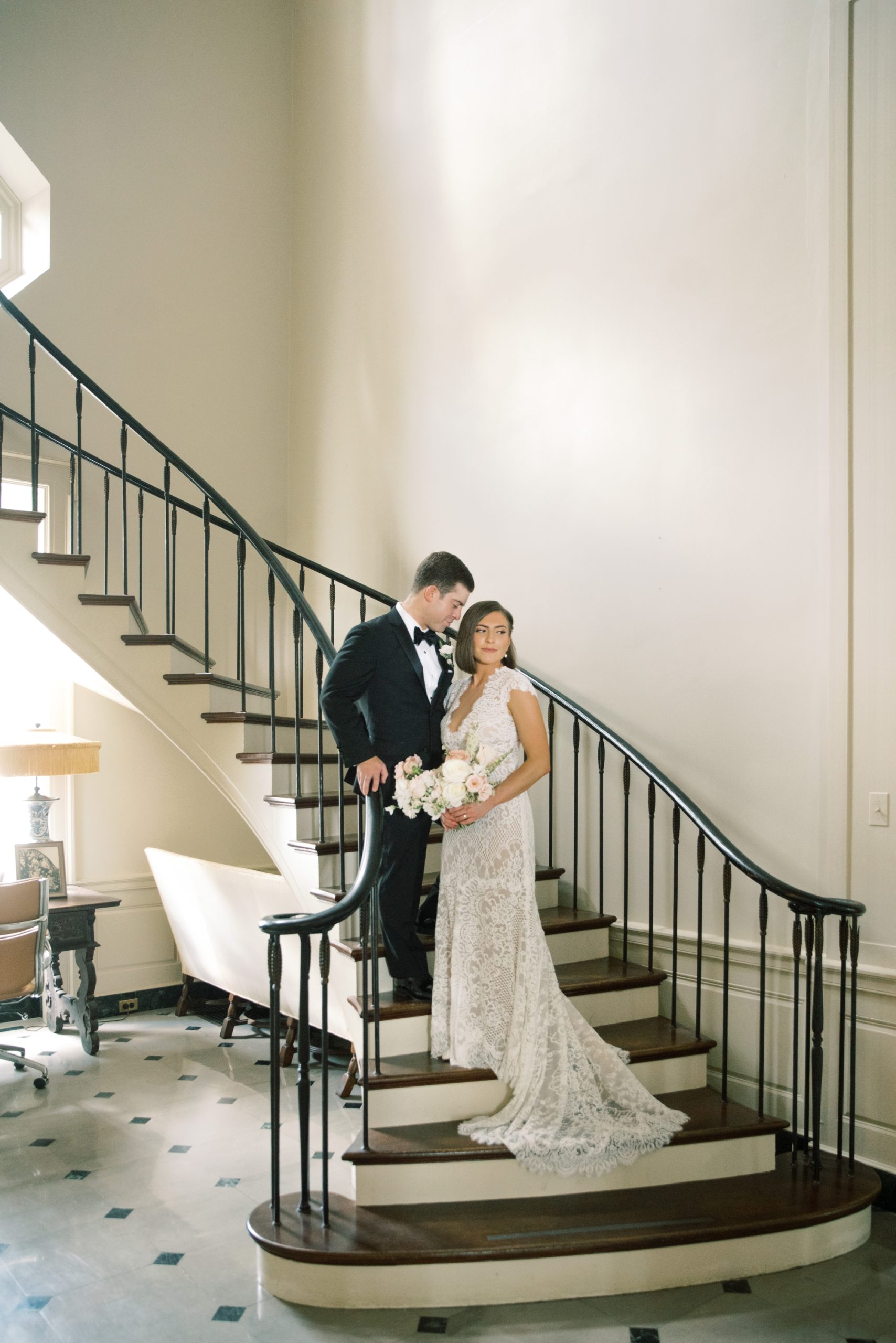 the couple posed on the grand staircase at Peterloon Estate