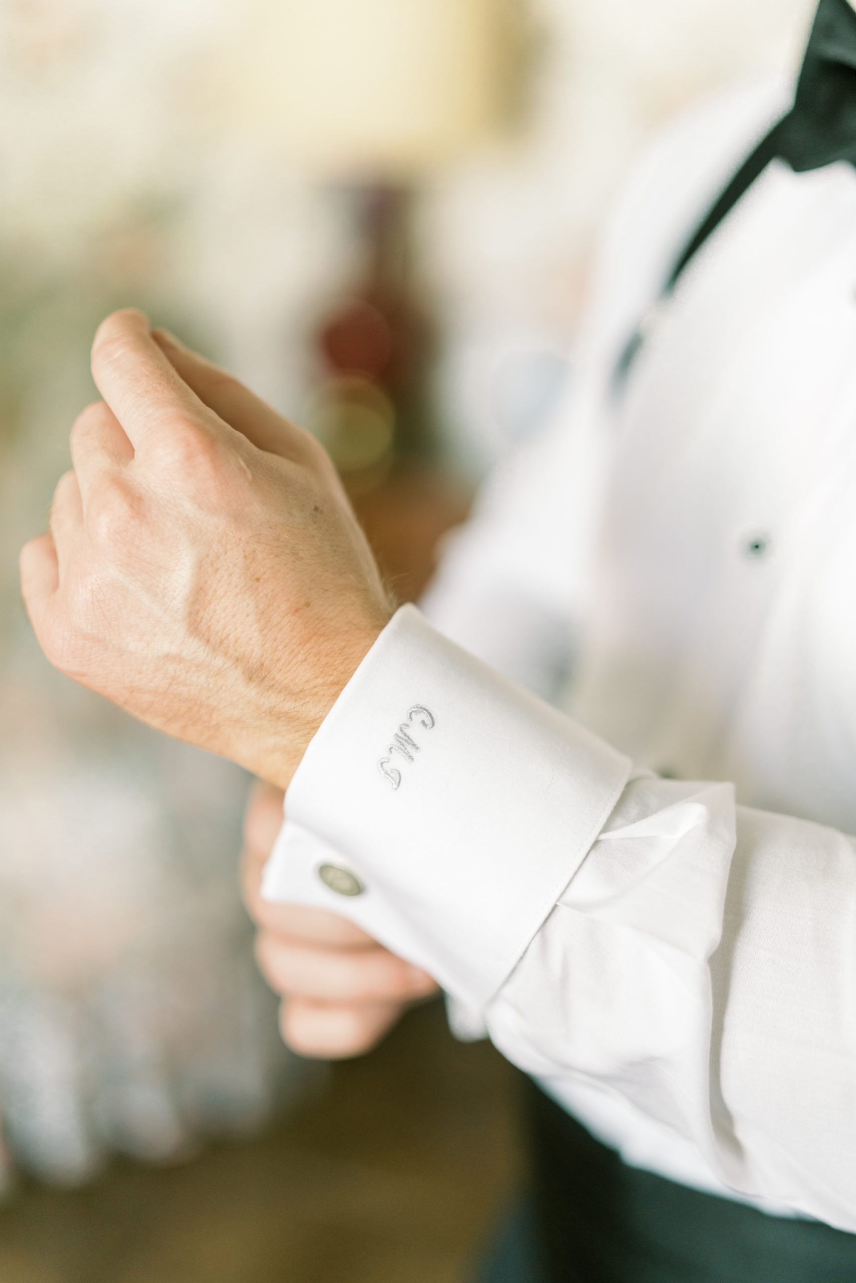 groom's tuxedo included monogram on the cuffs