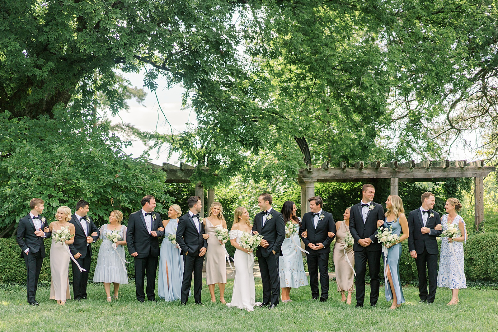 Bridal Party in Black Tux and Floral Print Bridesmaids Dresses