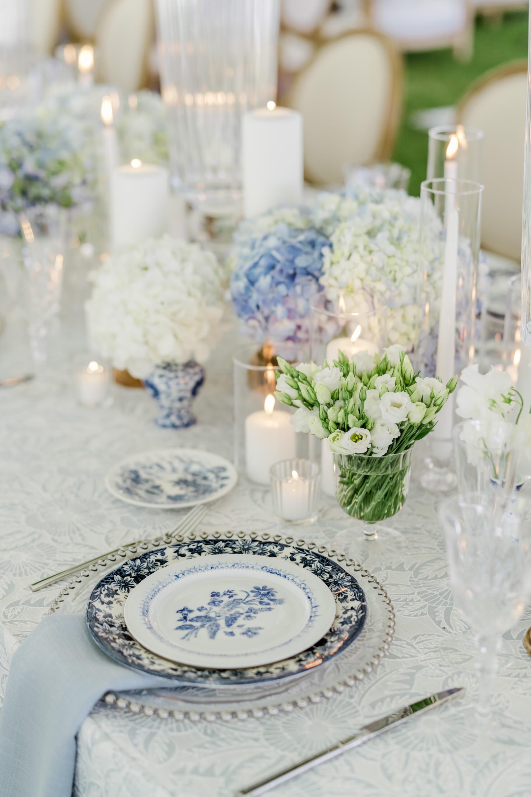Romantic candles and unique china at the wedding reception