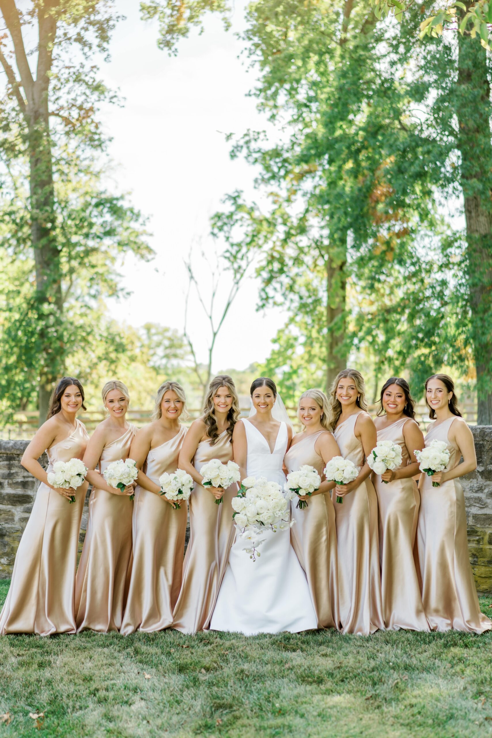 Bride with bridesmaids in champagne bridesmaids dresses