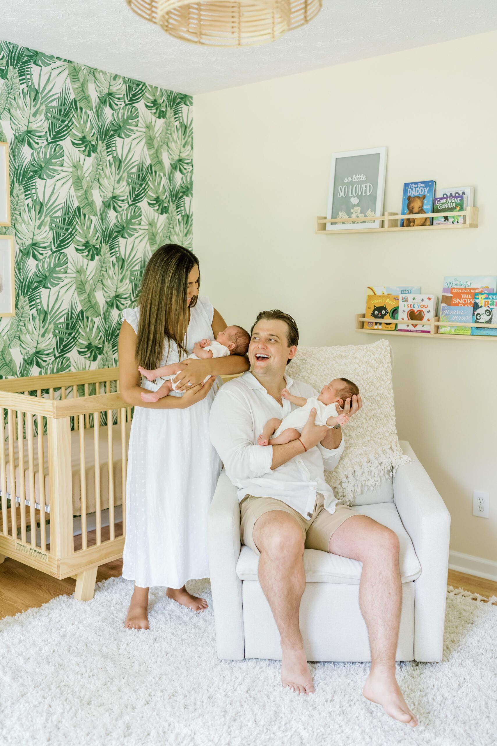 Mom and dad pose with twins at newborn session