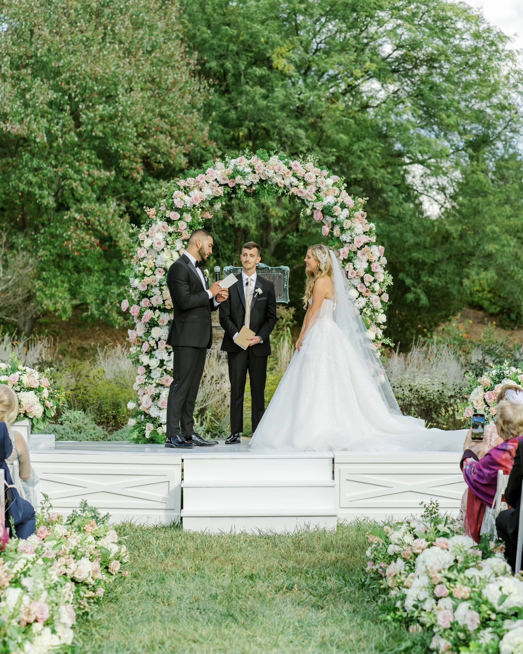 Bride and groom say vows at their Ault Park outdoor wedding ceremony