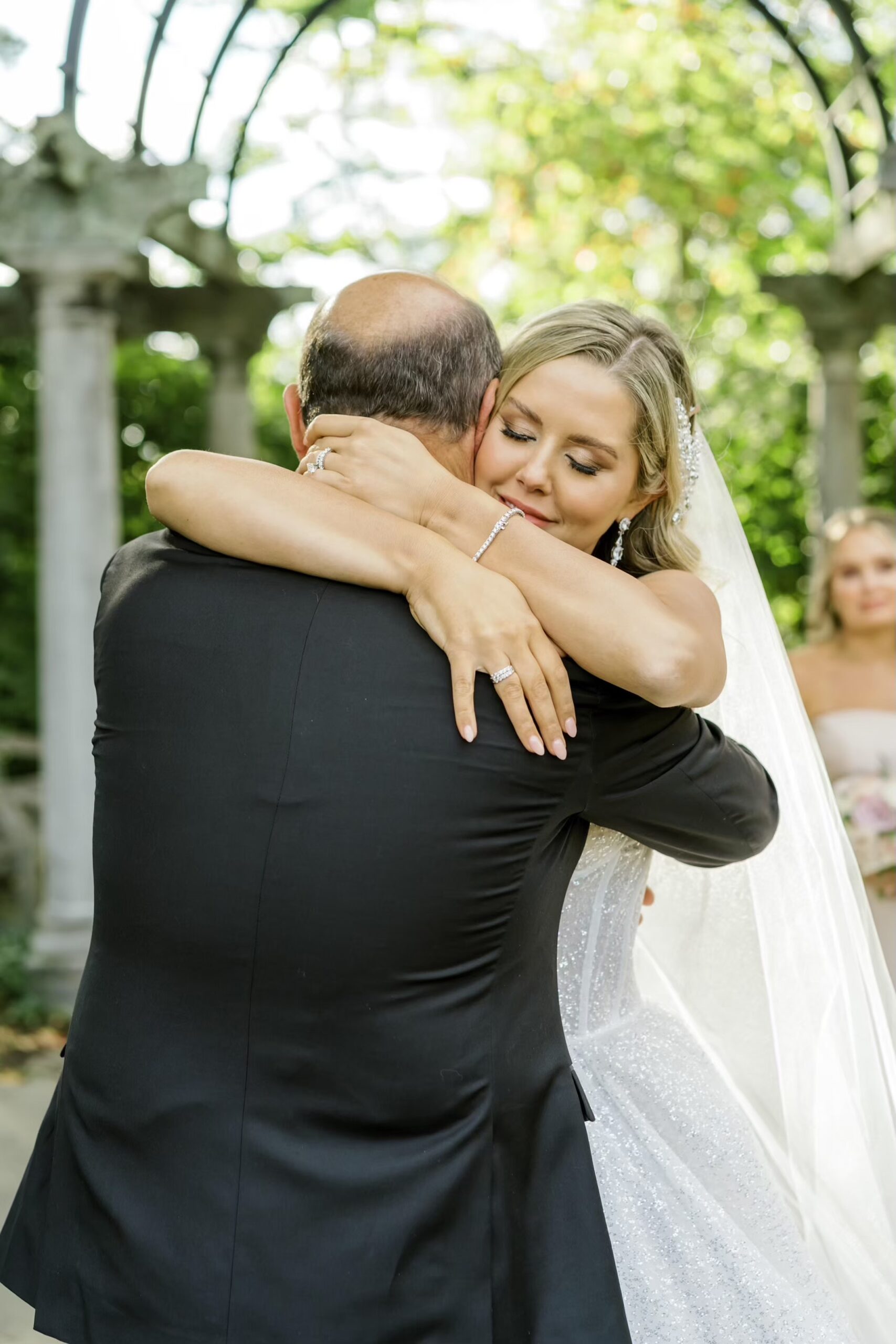 Bride hugs father