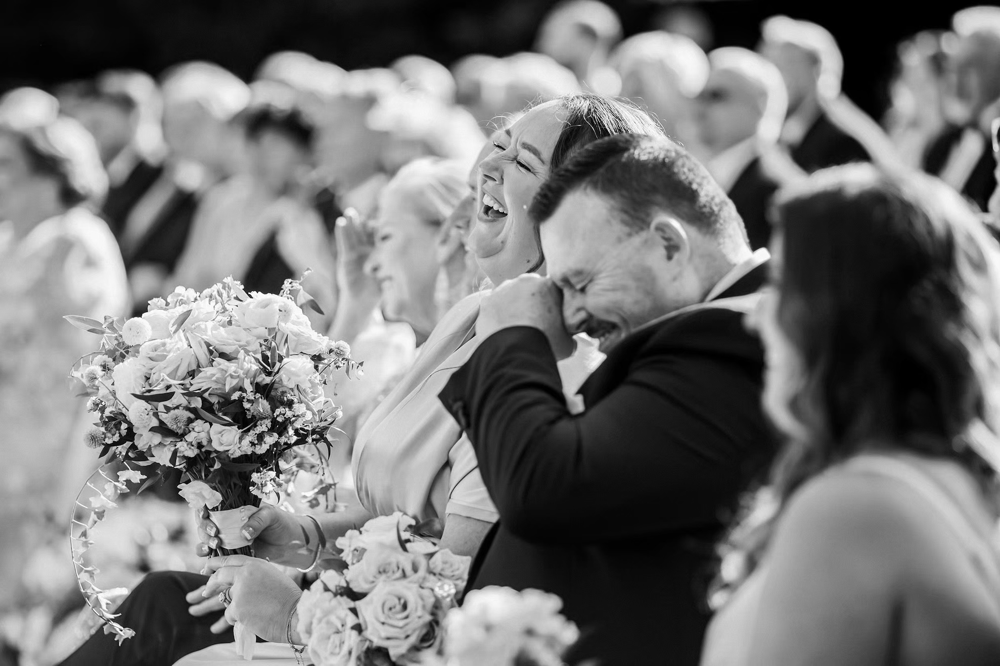 Guests laugh at the Ault Park wedding ceremony